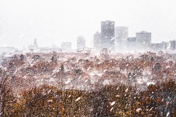 20171216-JAH07472:  A blustery Rochester NY city skyline from Cobbs Hill Reservoir.