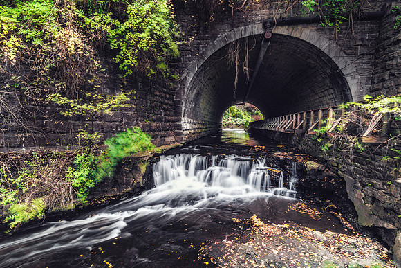 20181015-JAH04960:   Allens Creek runs through the train tunnel in Corbetts Glen nature park.